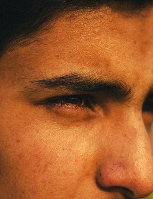 Close-up of a person's profile with eyes closed, in a state of calm meditation.